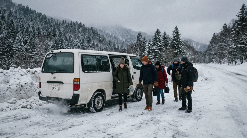 Tour van on a snow-banked road on the route from Sapporo to Noboribetsu for a Noboribetsu Bear Park visit, Hokkaido